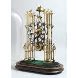 A VICTORIAN BRASS SKELETON CLOCK, CIRCA. 1900, with openwork dial, Roman numerals on a wooden