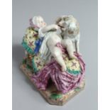A GOOD 18TH CENTURY MEISSEN PORCELAIN GROUP a baby on a bed playing with a dog. Cross swords mark in
