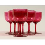 A SET OF EIGHT CRANBERRY WINE GOBLETS. 4.5ins high.