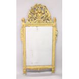 A 19TH CENTURY GILTWOOD PIER MIRROR, the cresting carved as a basket of fruit, foligae and tools,