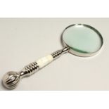 A MAGNIFYING GLASS WITH CHROME AND MOTHER OF PEARL HANDLE.