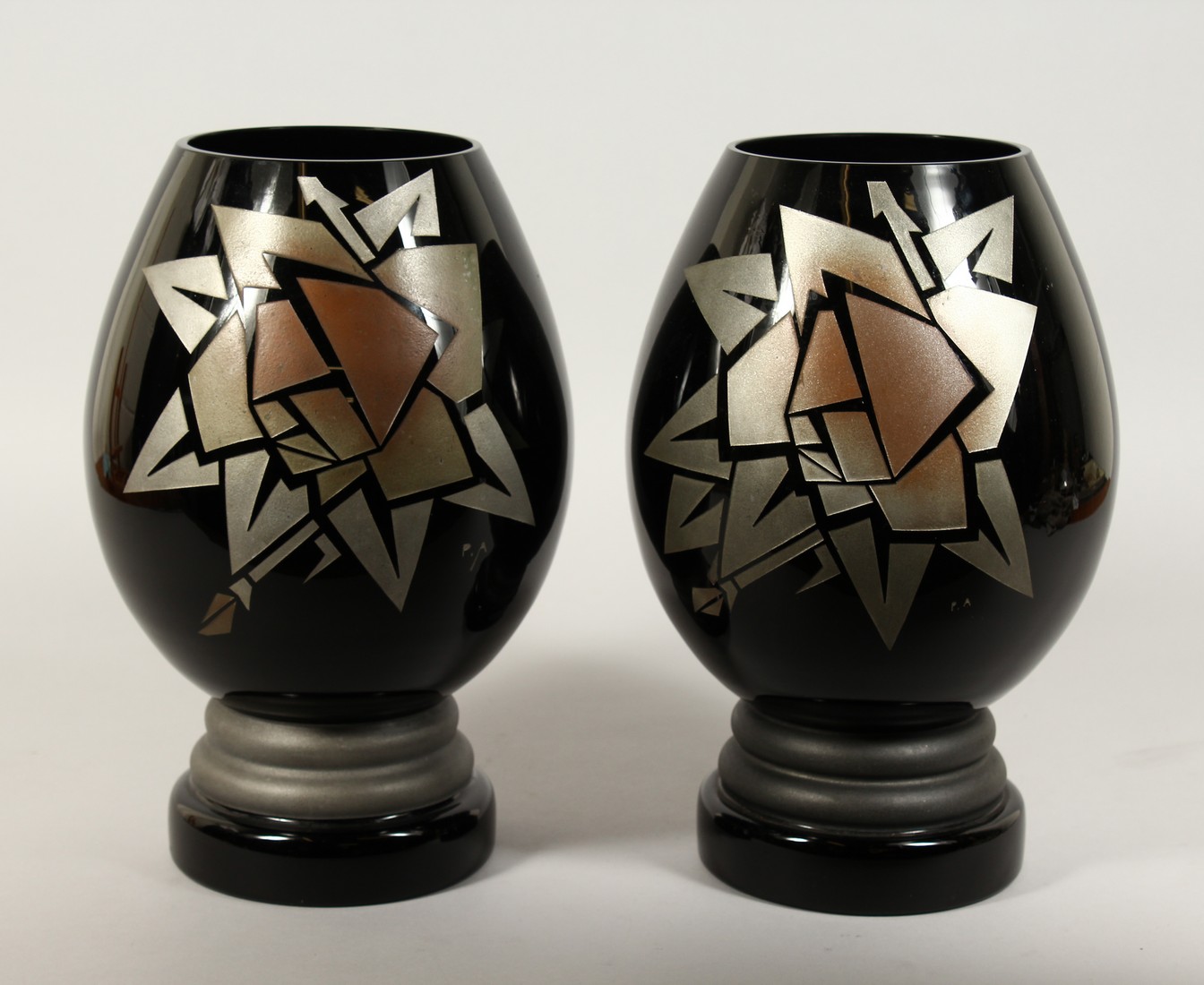 A GOOD PAIR OF CHARDER ART DECO GLASS VASES with stylised geometric design. 12ins high.