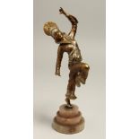 A GOOD ART DECO BRONZE DANCER on a circular stepped base.