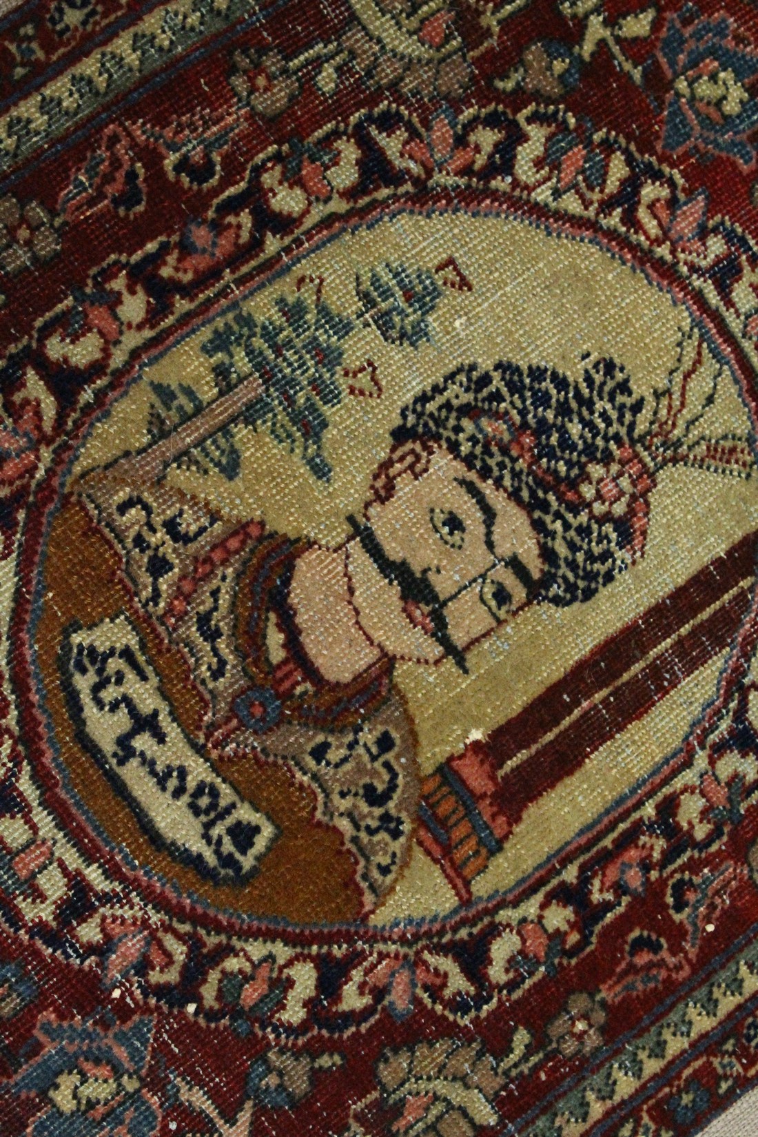A SMALL PERSIAN MAT / WALL HANGING woven with a portrait of the King of Persia. Overall size 2ft 9. - Image 2 of 3