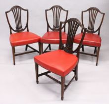 A SET OF FOUR HEPPLEWHITE MAHOGANY SHIELD BACK SINGLE CHAIRS with leather seats.