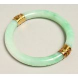 A GOOD JADE AND GOLD BANGLE