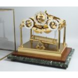 ANDREW FELL. A SUPERB LIMITED EDITION LACQUERED BRASS ARCHITECTURAL DESIGN ROLLING BALL CLOCK,