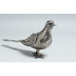 A SMALL SILVER PHEASANT with detatchable head. 9ins high.