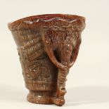 A CARVED CHINESE HORN LIBATION CUP. 5ins high.