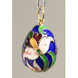 A RUSSIAN SILVER AND ENAMEL EGG PENDANT.