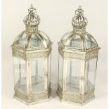 A PAIR OF METAL AND GLASS HEXAGONAL LANTERNS.