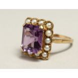 AN AMETHYST AND PEARL RING