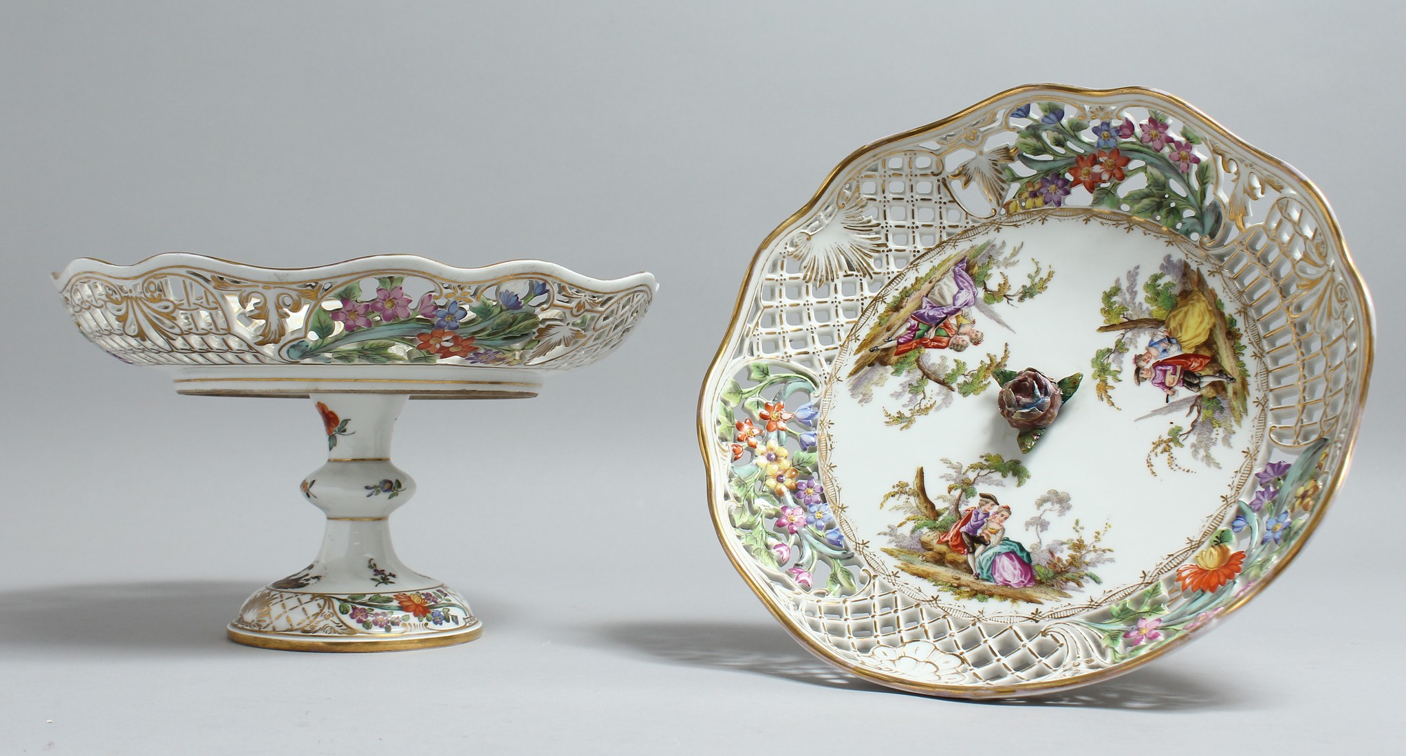 A VERY GOOD PAIR OF 19TH CENTURY DRESDEN PIERCED COMPORTS painted with flowers and figures mark in