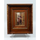 A FRAMED LIMOGES ENAMEL PLAQUE OF A STANDING MAN READING. Label on reverse V. COT LIMONGES 7 x4.