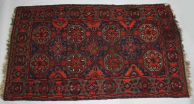 A GOOD LARGE CAUCASIAN SUMAK CARPET, deep red ground with all over stylized design. 11ft 10ins x 7