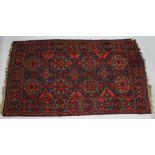 A GOOD LARGE CAUCASIAN SUMAK CARPET, deep red ground with all over stylized design. 11ft 10ins x 7