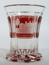 A GOOD BOHEMIAN GOBLET with engraved buildings on a ruby background. 4ins high.
