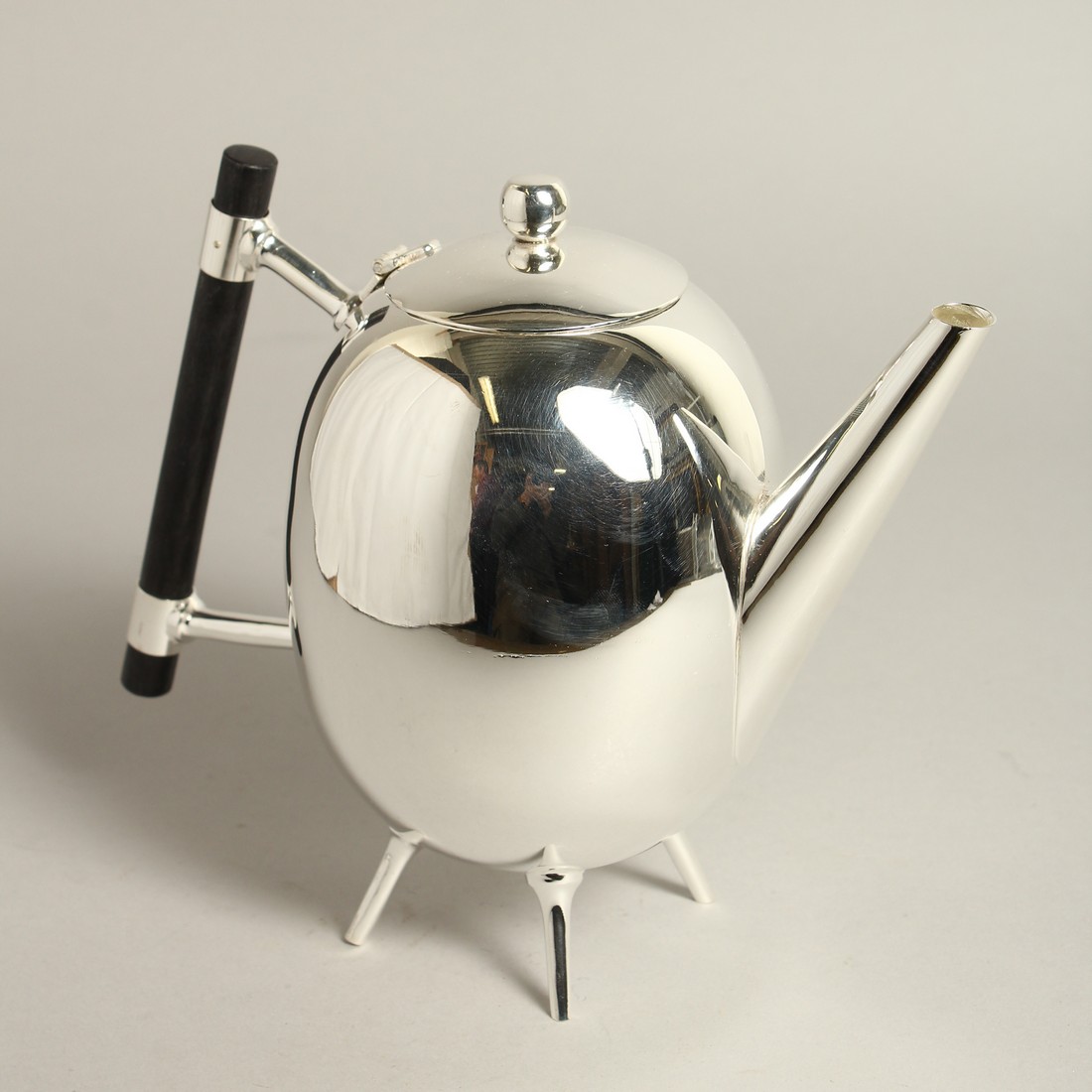 A CHRSTOPHER DRESSER DESIGN SILVER PLATE EGG SHAPED TEA POT.