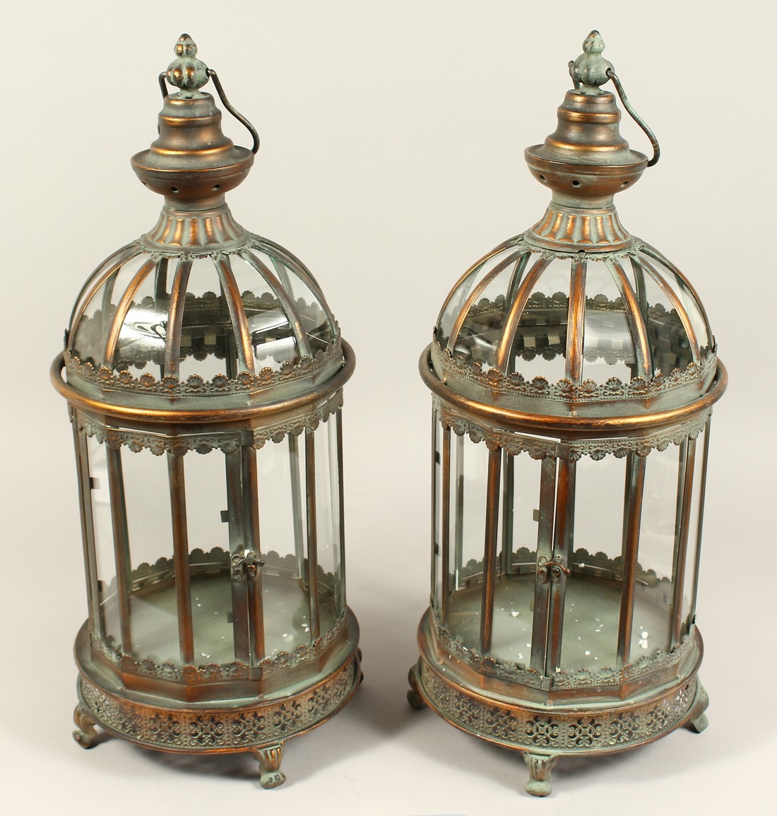 A PAIR OF METAL AND GLASS LANTERNS
