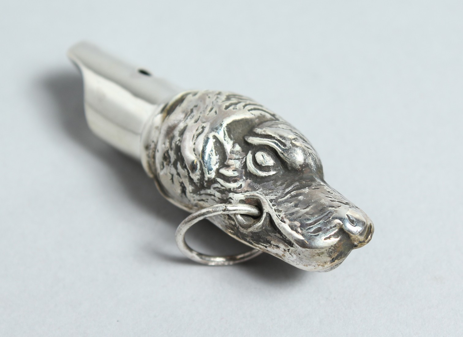 A SILVER DOG'S HEAD WHISTLE