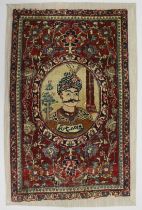 A SMALL PERSIAN MAT / WALL HANGING woven with a portrait of the King of Persia. Overall size 2ft 9.