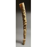 A CARVED IVORY OLIPHANT. 18ins long.