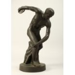 A GRAND TOUR BRONZE DISCUS THROWER on a circular base.