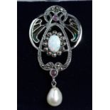 A SILVER PEARL AND RUBY BROOCH.