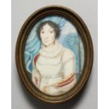 AN EARLY CONTINENTAL OVAL MINIATURE OF A LADY. 2.25ins x 1.75ins.