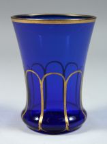 A GOOD BLUE GLASS GOBLET with gilt decoration. 4ins high