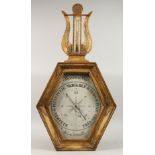 AN 18TH CENTURY TORICELLI TYPE BAROMETER, in a gilt wood frame, the octagonal dial, 6ins x 12ins,
