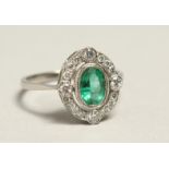 A GOOD 18CT GOLD, EMERALD AND DIAMOND CLUSTER RING