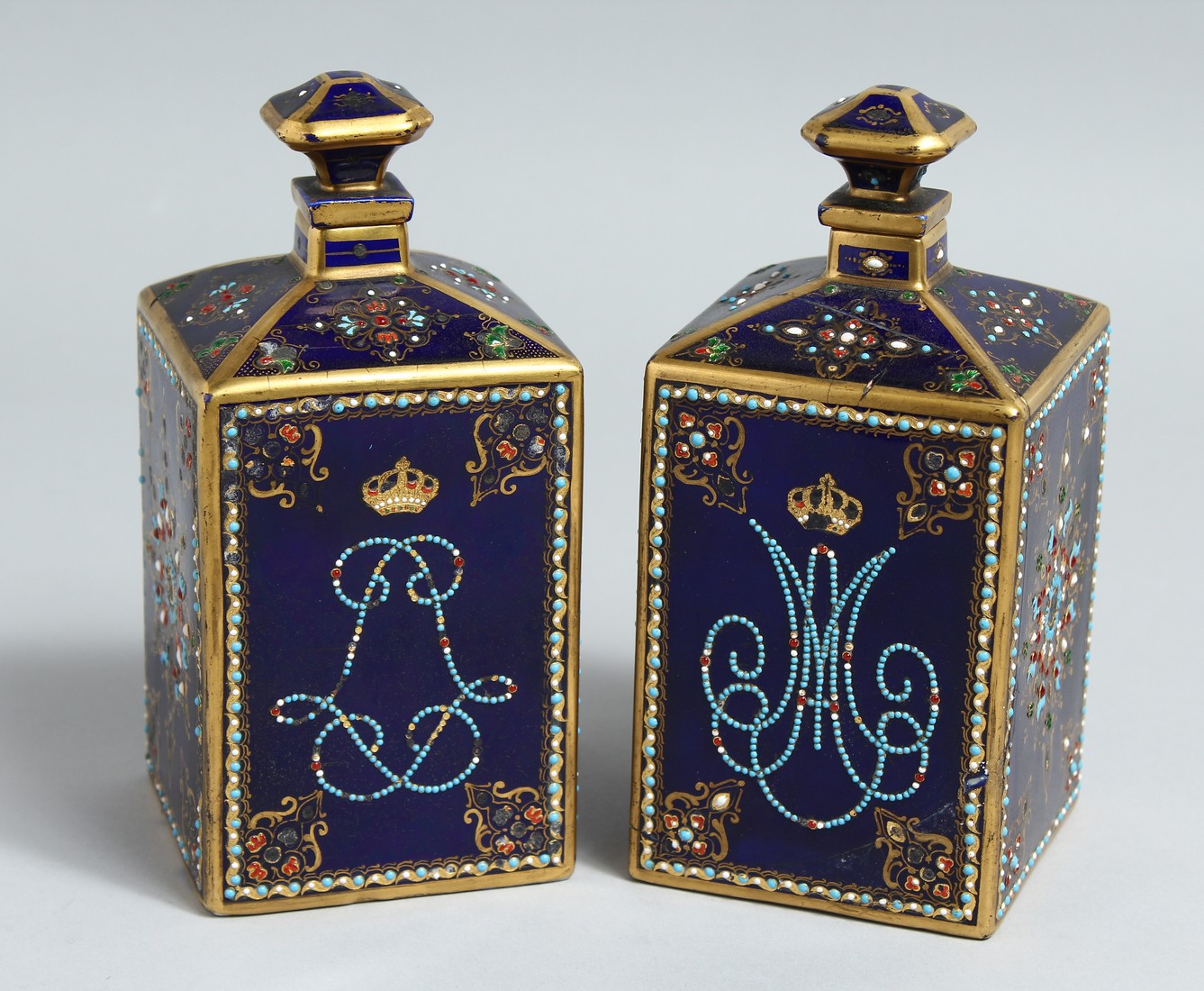 A NEAR PAIR OF 19TH CENTURY, SEVRES, FRENCH BLUE, PORCELAIN SQUARE BOTTLES AND STOPPERS with gilt