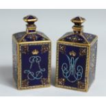 A NEAR PAIR OF 19TH CENTURY, SEVRES, FRENCH BLUE, PORCELAIN SQUARE BOTTLES AND STOPPERS with gilt