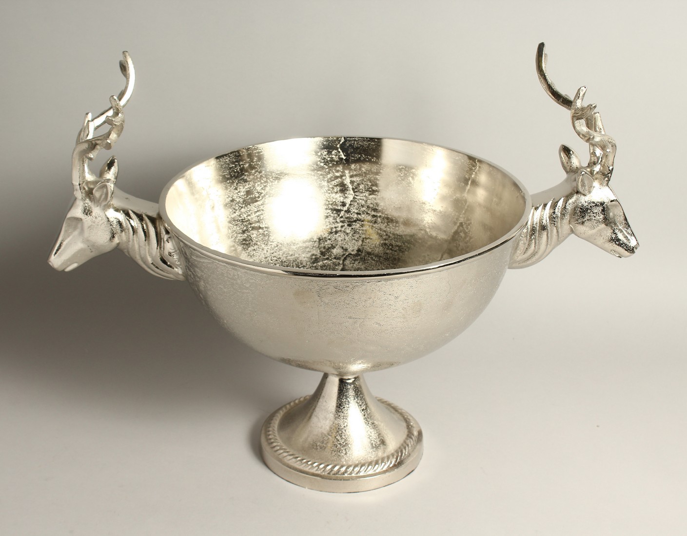 A CIRCULAR PEDESTAL WINE COOLER with stag handles 13ins diameter.