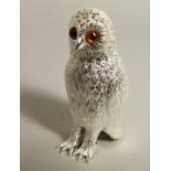 A SILVER PLATED OWL SUGAR SIFTER