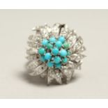 A VERY GOOD 18CT WHITE GOLD RUBY, DIAMOND AND TURQUOISE CLUSTER RING.