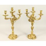 A GOOD PAIR OF ROCOCCO ORMOLU FOUR LIGHT CANDELABRA, with four naturalistic scrolling branches on