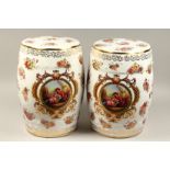 A PAIR OF CHINESE ROSE PORCELAIN BARREL SEATS flowers and birds. 18ins high.