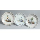 THREE 18TH CENTURY FAIENCE PLATES two with chickens, one with an urn. 8ins diameter.