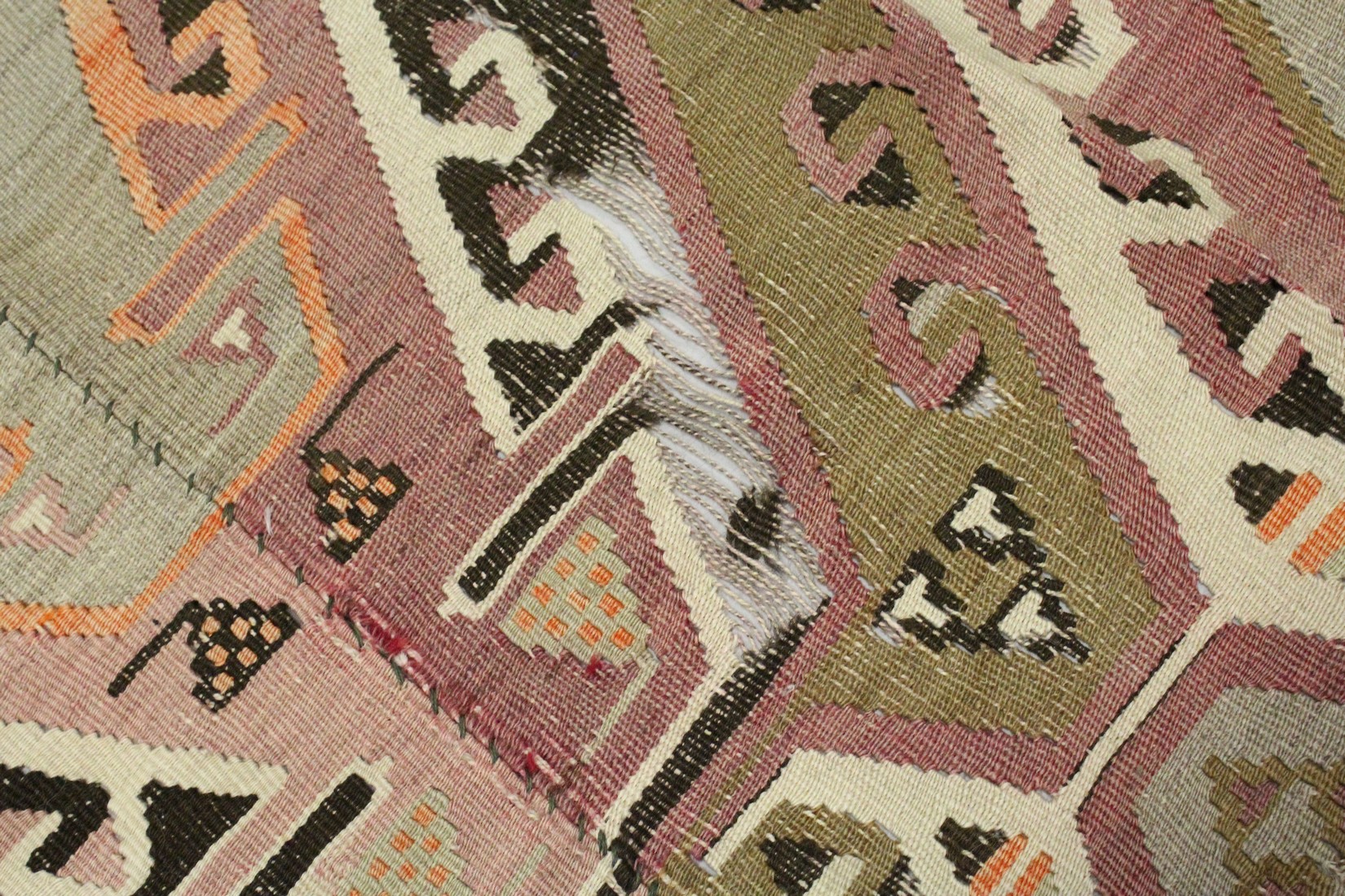 A TURKISH KELIM CARPET, with central join, pink ground with four large medallions. 12ft 6ins x 5ft. - Image 2 of 7