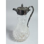 A CUT GLASS CLARET JUG with silver plated mounts. 11.5ins high.