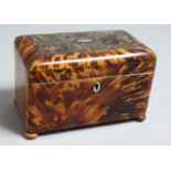 A GOOD REGENCY TORTOISESHELL STRAIGHT FRONTED TWO DIVISION TEA CADDY, ON FOUR BUN FEET. 6.5ins long