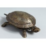 A NOVELTY BRONZE TORTOISE TABLE BELL.