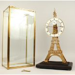 A GOOD EIFFEL TOWER SKELETON CLOCK in a glass case. 22ins high.