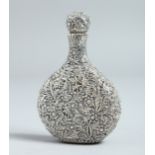 A CHINESE WHITE METAL EMBOSSED PERFUME BOTTLE