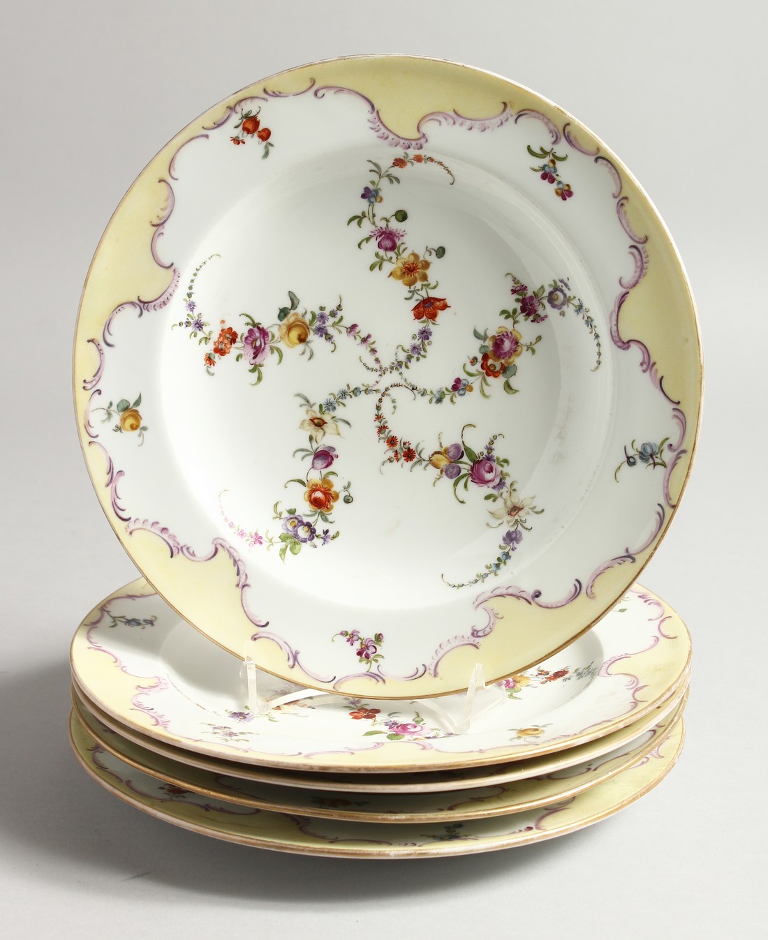 A SET OF FIVE 19TH CENTURY MEISSEN PLATES painted with garlands Cross swords mark in blue 9ins