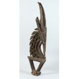 AN AFRICAN CARVED WOOD GOAT FIGURE 30ins long.