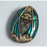 A BRASS ENAMEL BAT VESTA