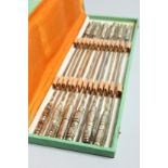 A BOXED SET OF TWELVES SKEWERS with silver plated handles 14ins long